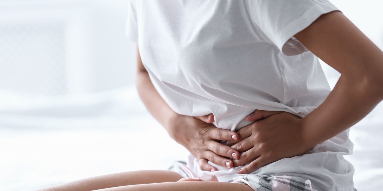 Women holding stomach